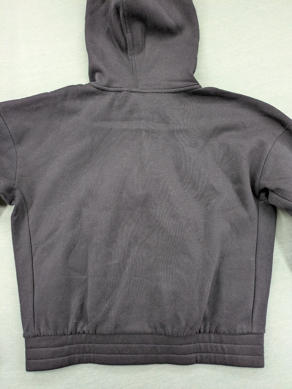 Puma grey zip-through hoodie with iconic logo and two practical pockets.