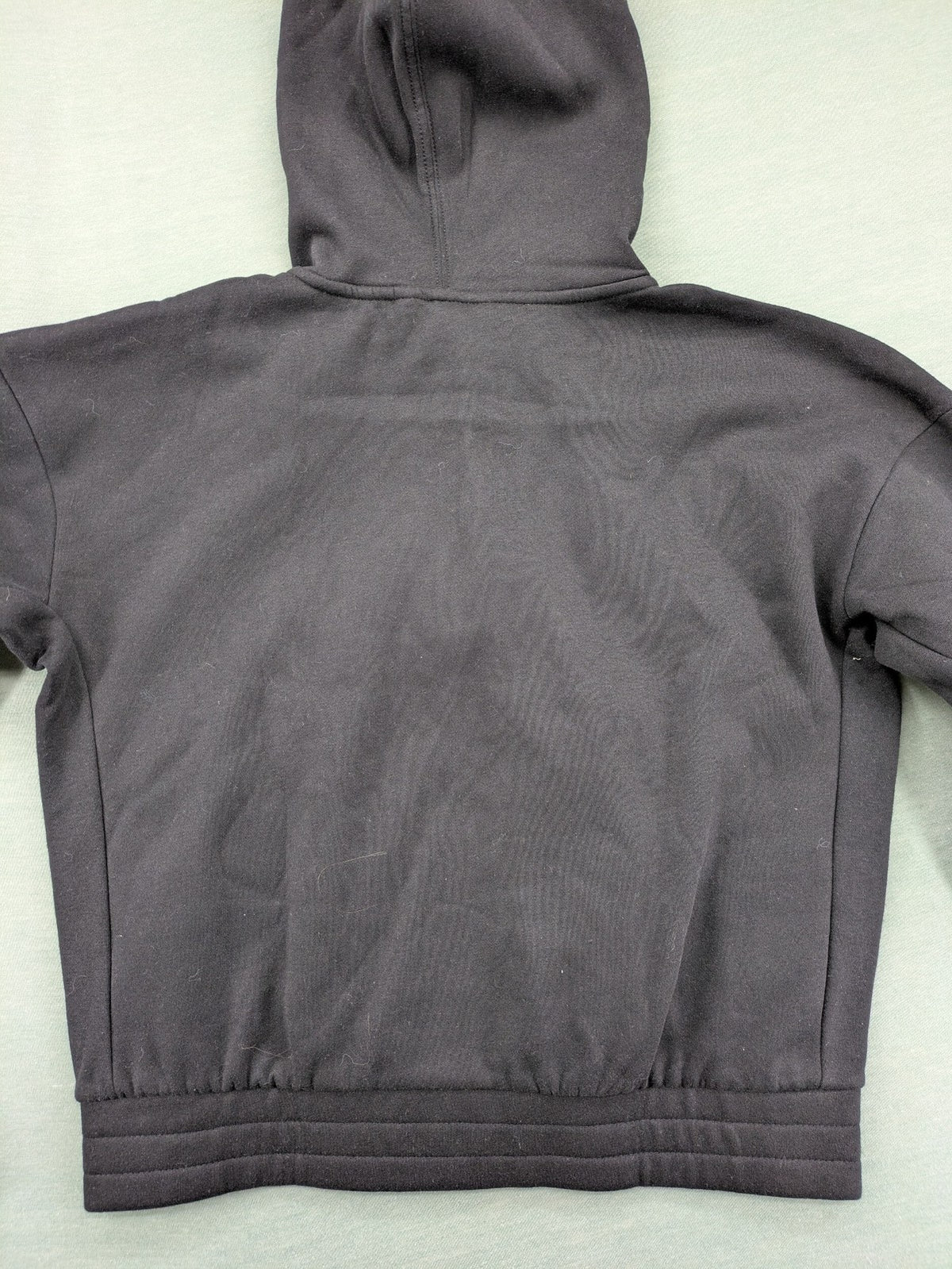 Puma grey zip-through hoodie with iconic logo and two practical pockets.