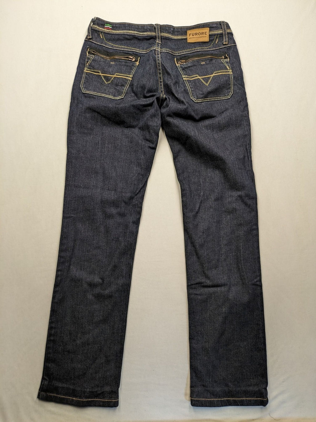 Furore blue straight jeans with yellow contrast stitching and zipper details.