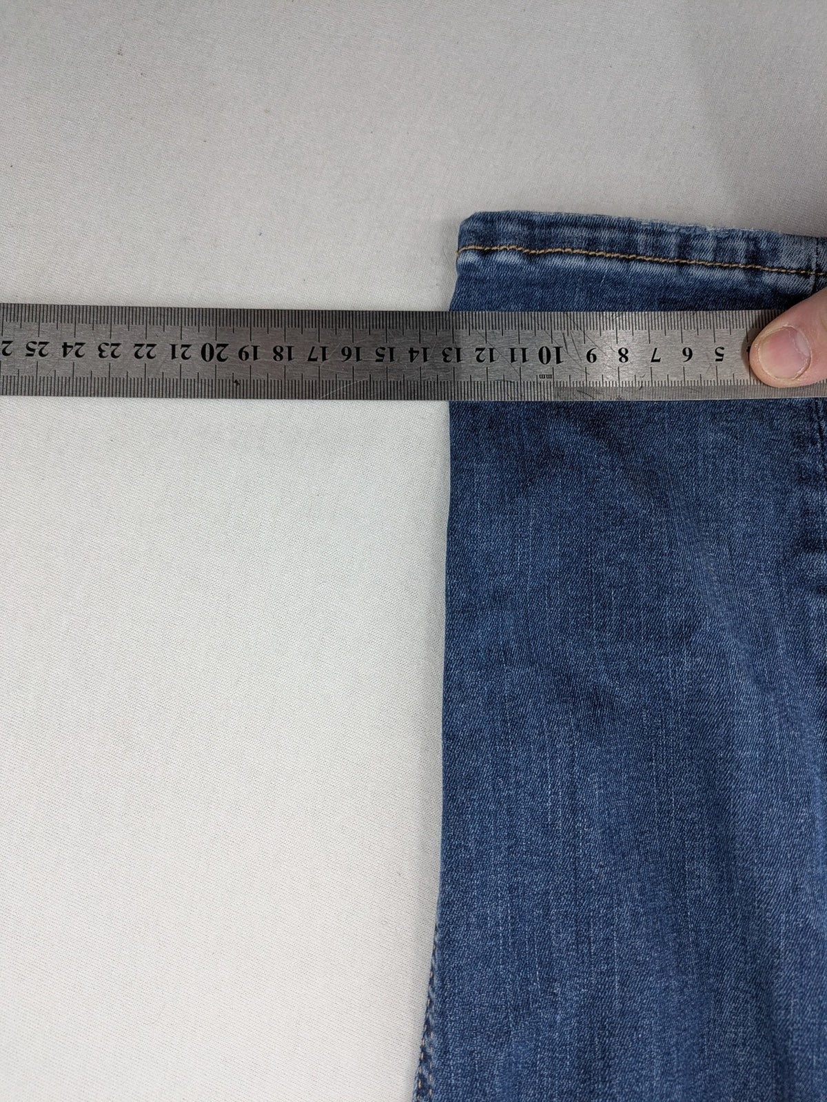 H&M blue skinny jeans with distressed details and comfortable stretch denim material.