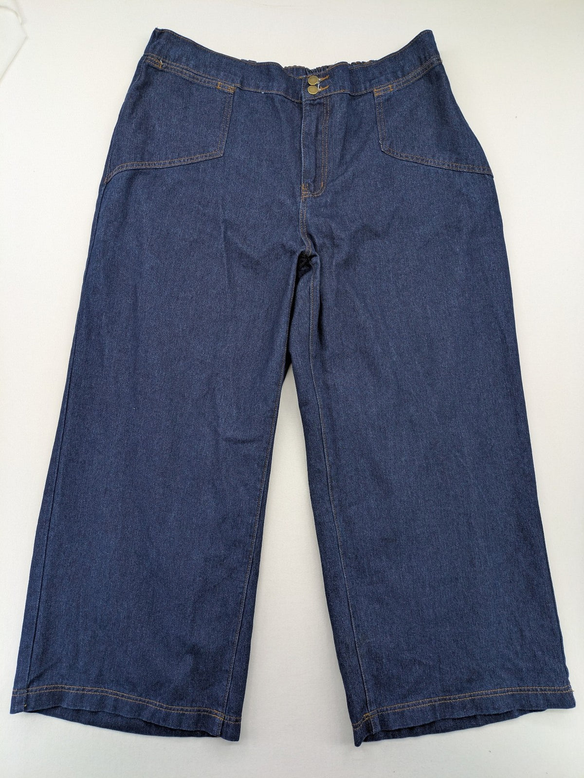 Emery Rose pink culotte pants with wide legs, double button closure, and soft denim blend.
