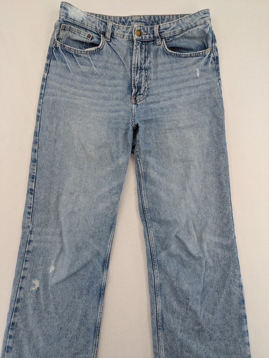 H&M blue wide leg jeans with distressed details and high waist, 100% cotton.