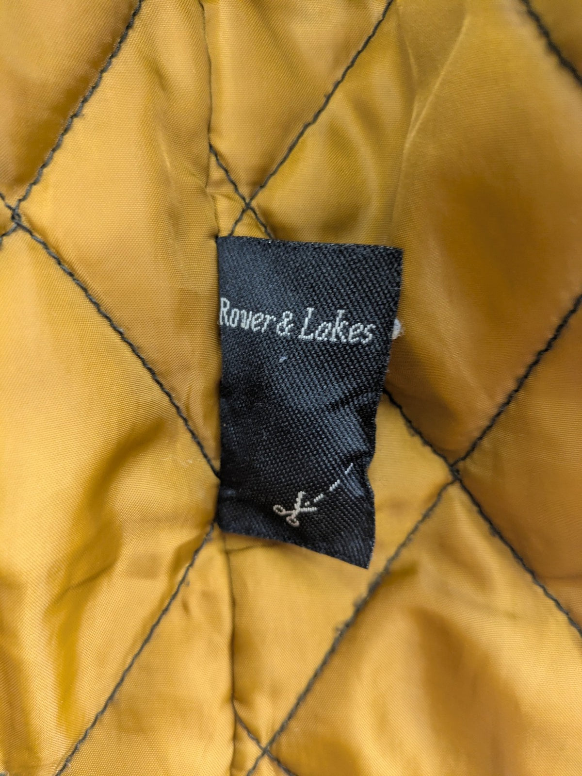 Rover & Lakes grey jacket with hood, quilted lining, and multiple pockets.