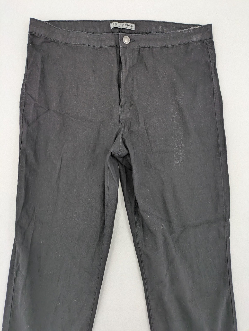 Denim & Co. black straight jeans with front button closure and back pockets.