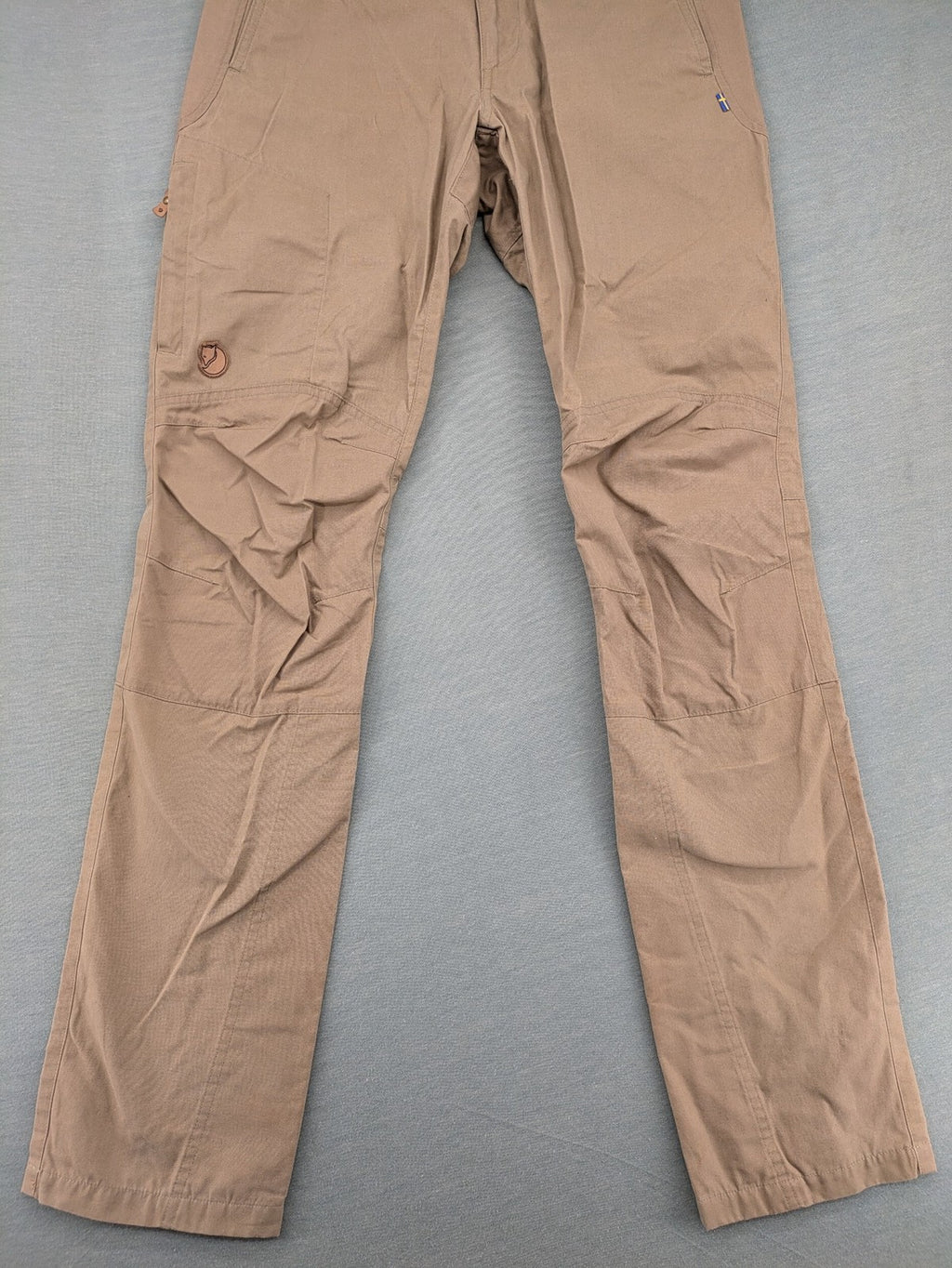 Fjällräven beige pants regular fit durable fabric outdoor style with logo detail.