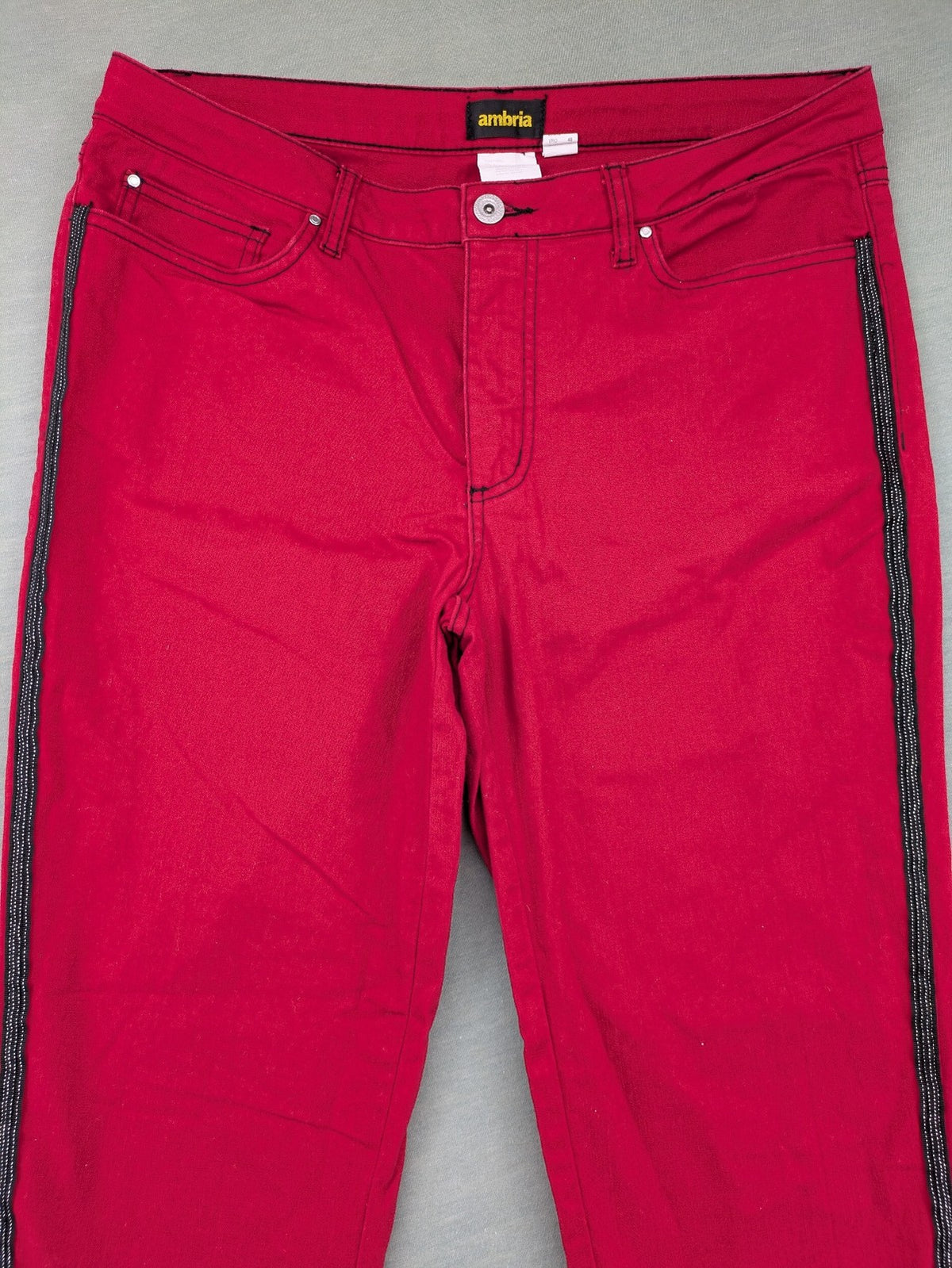 Ambria red straight jeans with black side stripe, classic five-pocket design, stretch cotton blend.