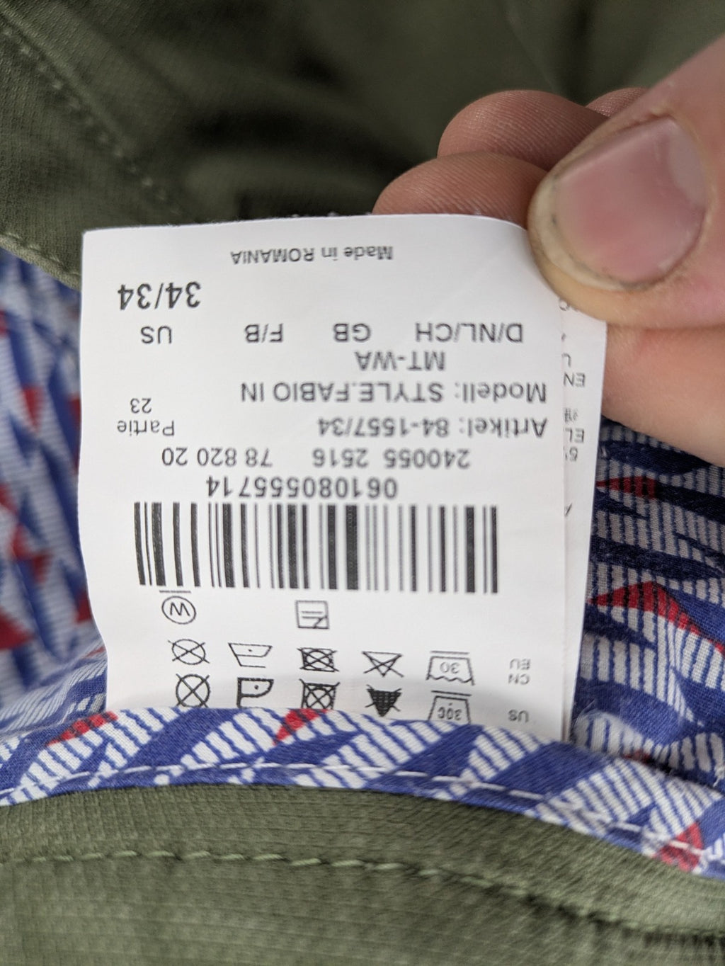 BRAX green chino pants flat-front design with zipper and buttoned back pockets.