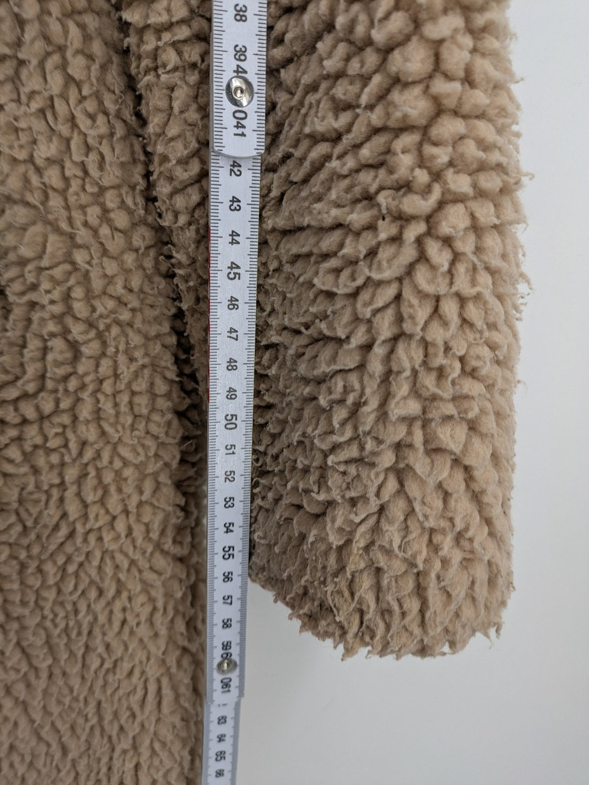 Clockhouse beige teddy coat longline design soft faux fur material with notched collar.