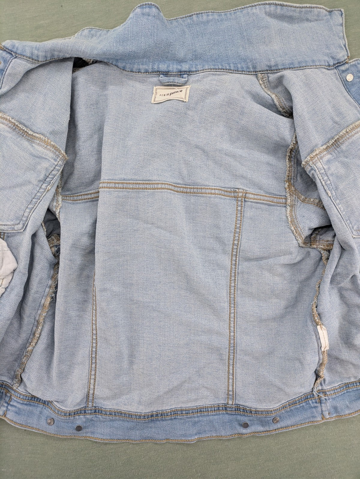 Pimkie blue denim jacket with classic cut, button placket, and two chest pockets.