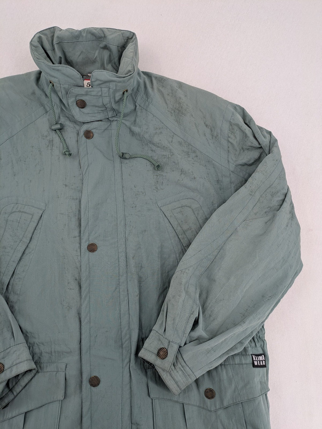 Klima green jacket vintage style, windproof, waterproof, with hidden hood and multiple pockets.