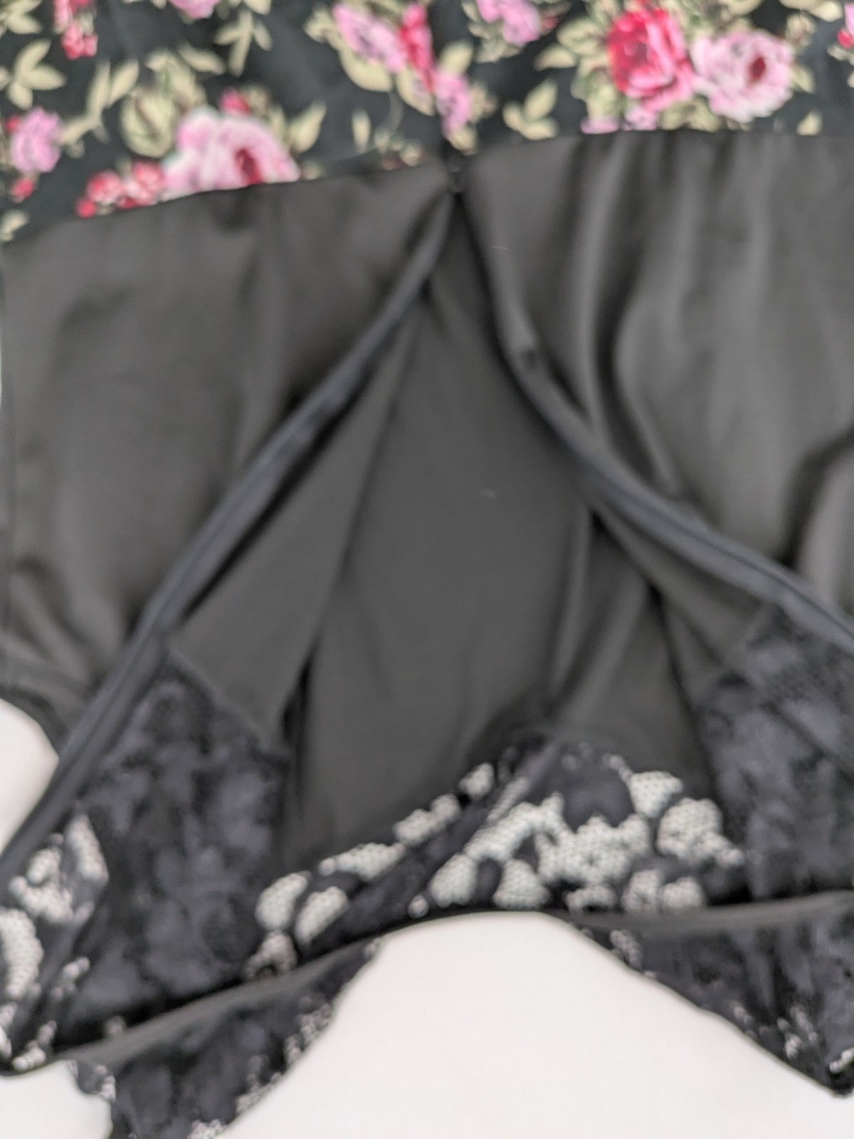 M/L black A-line dress with floral skirt and lace trim details.