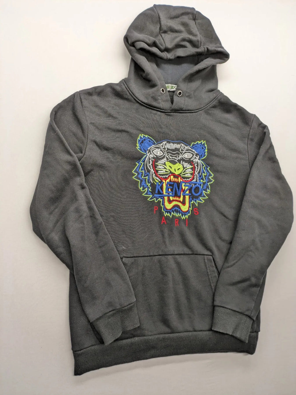 Kenzo multi hoodie with embroidered tiger graphic, drawstring hood, and kangaroo pocket.