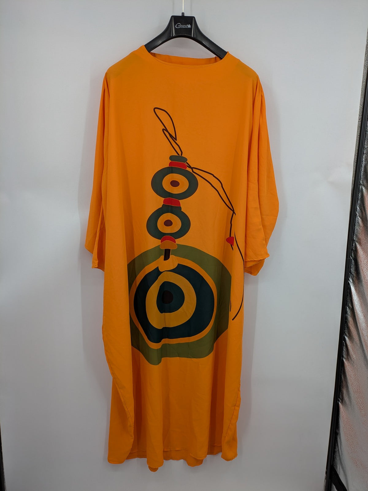 Kaftan orange oversized summer dress with unique graphic print and long sleeves.