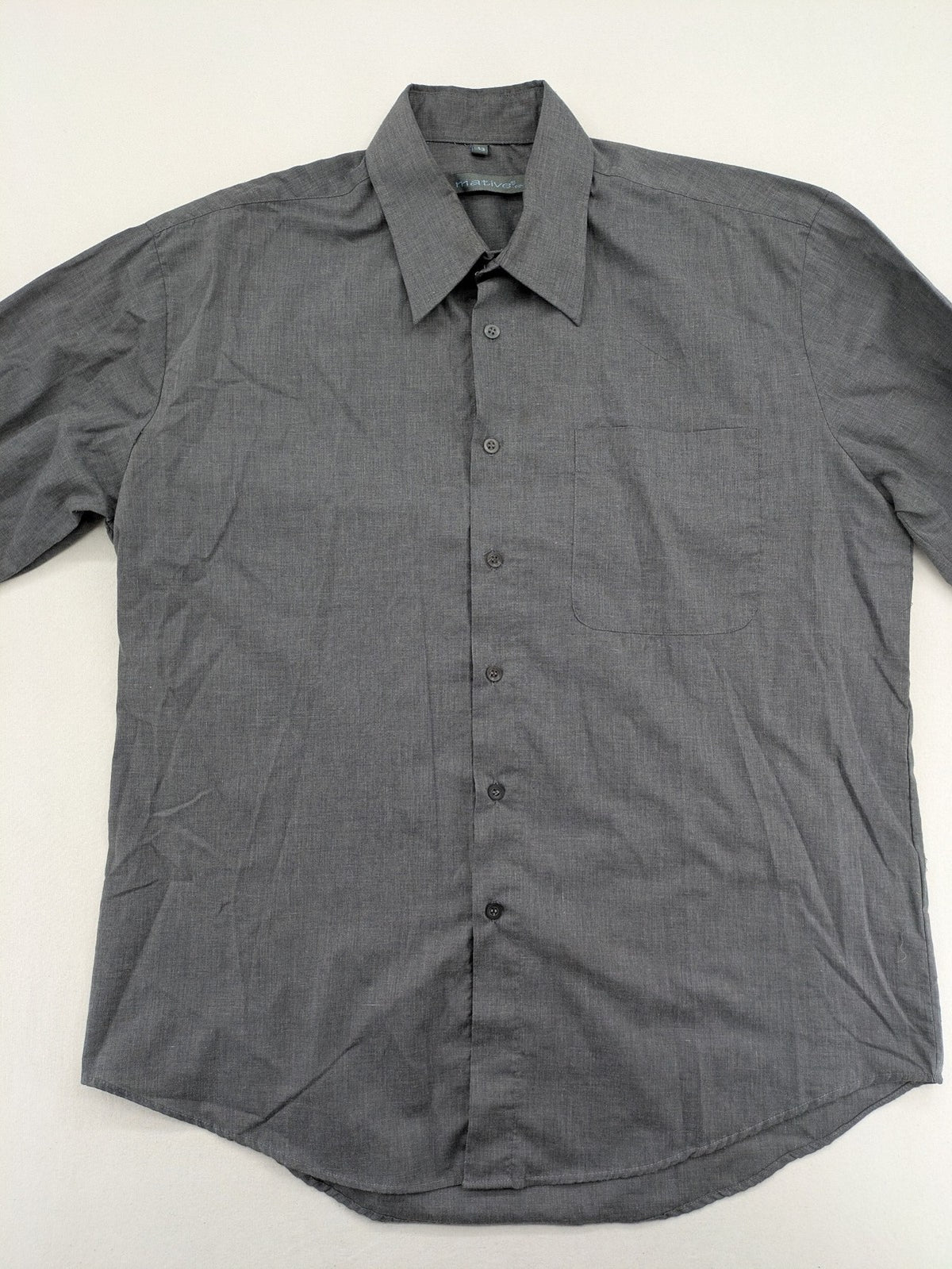Mative pink button-up shirt with classic collar, chest pocket, cotton-polyester blend.