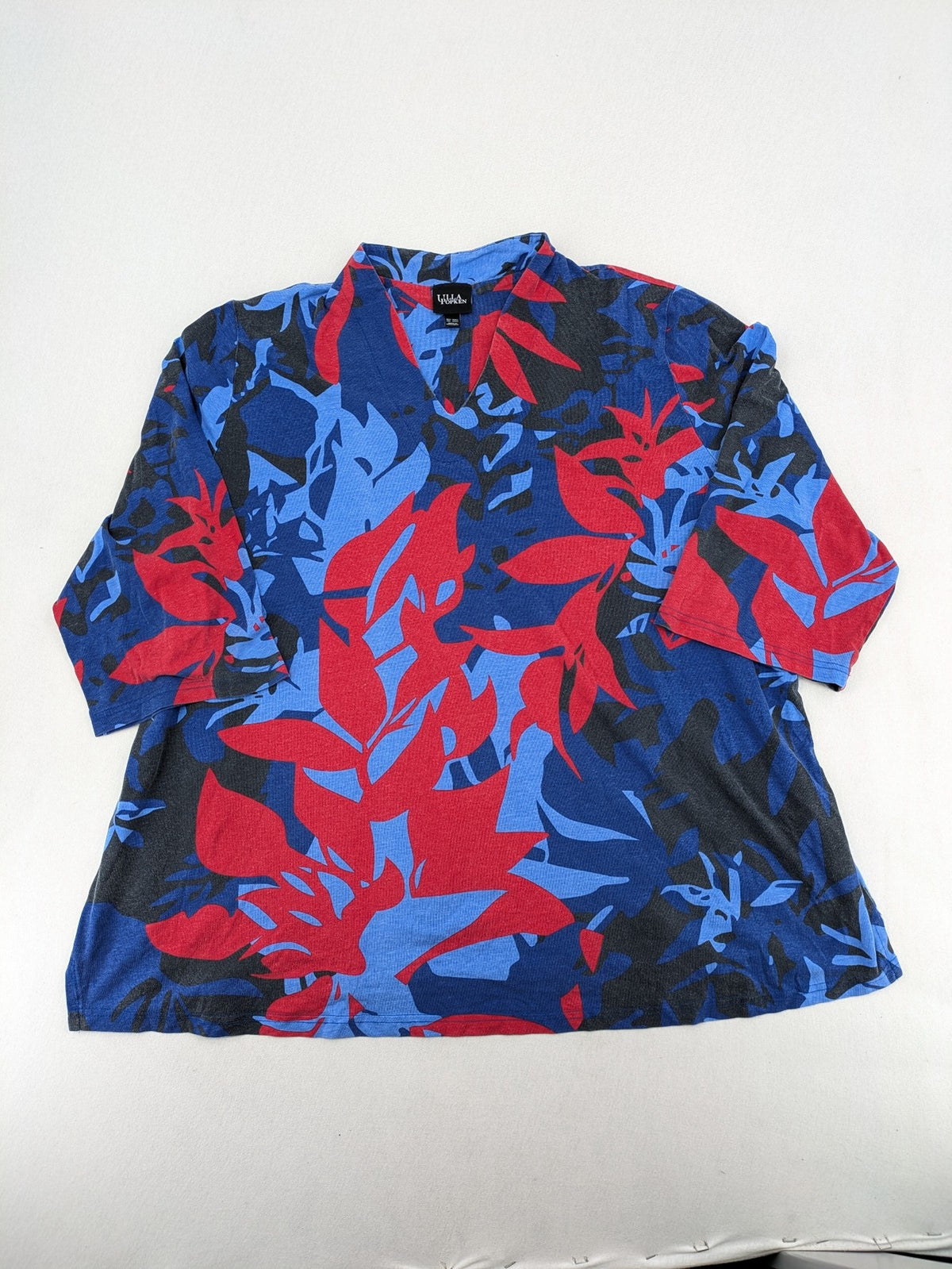 Ulla Popken blue top with floral print, V-neck, 3/4 sleeves, soft cotton blend.