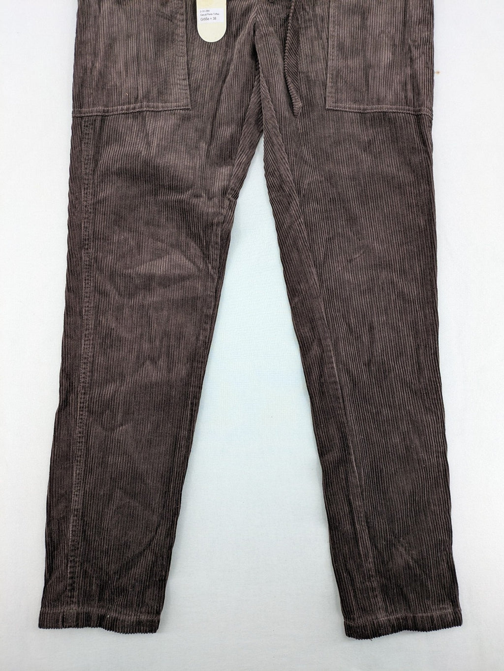 Alma & Lovis cream cord pants high-waist with matching belt and front pockets.