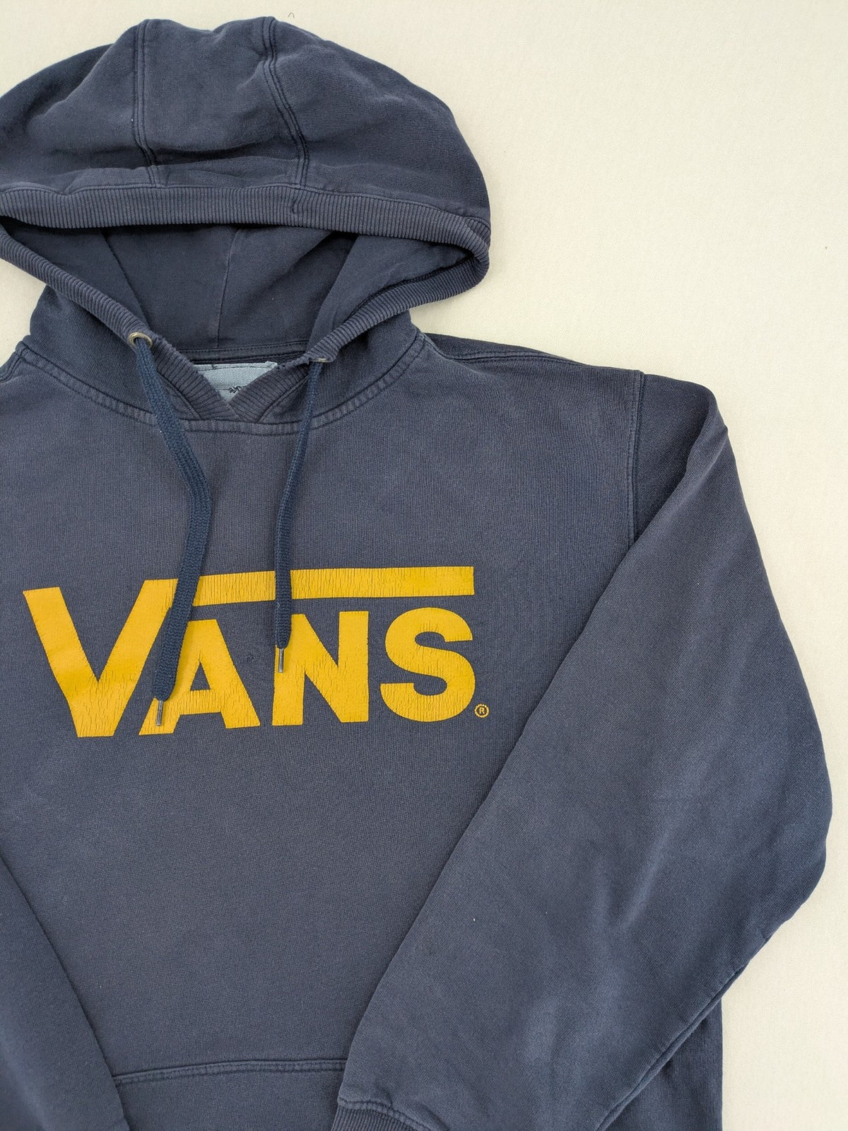 Vans zip-through hoodie navy blue with large yellow logo and kangaroo pocket.