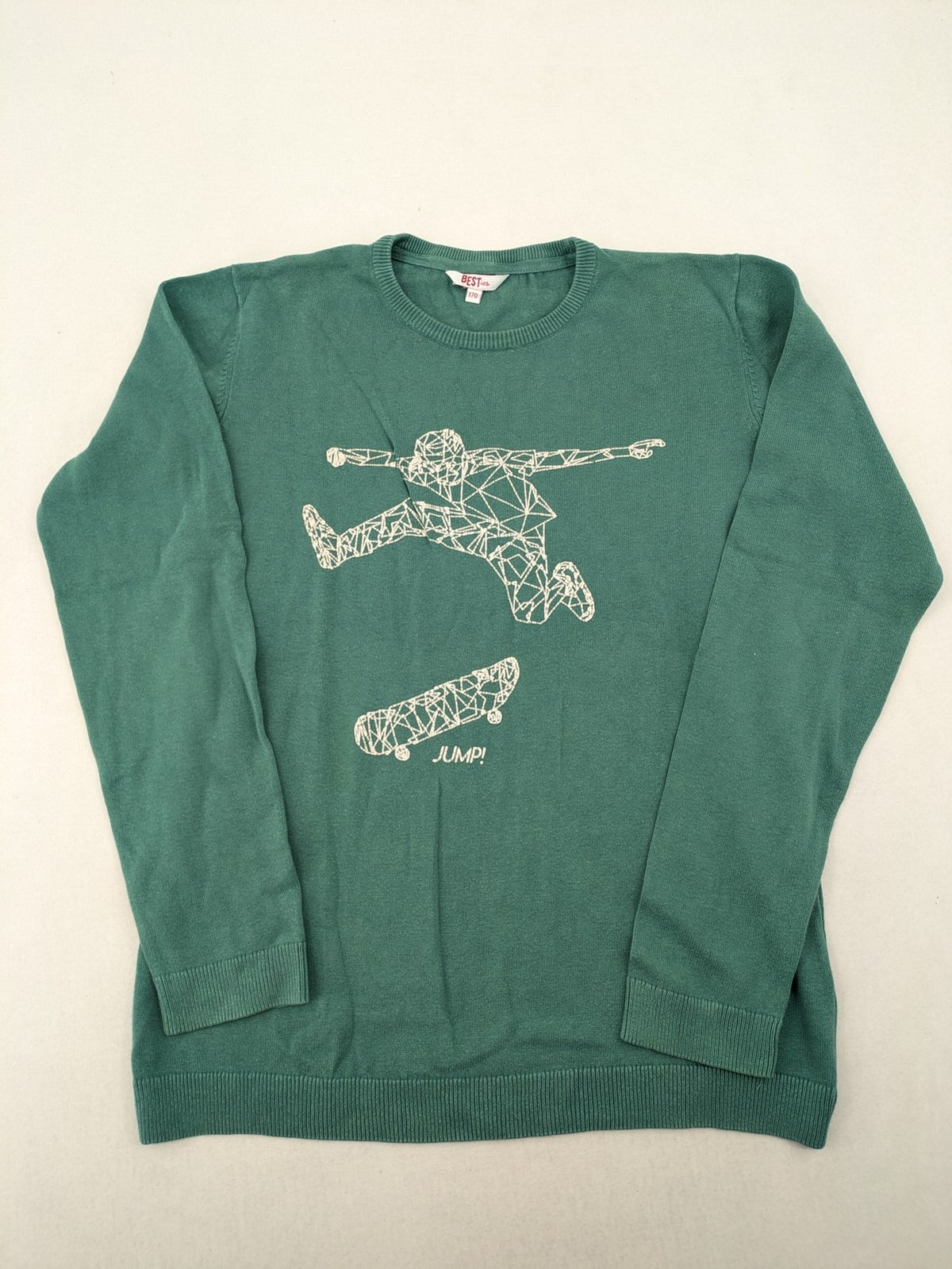 BESTies green turtle neck jumper with white skateboard graphic and ribbed cuffs.