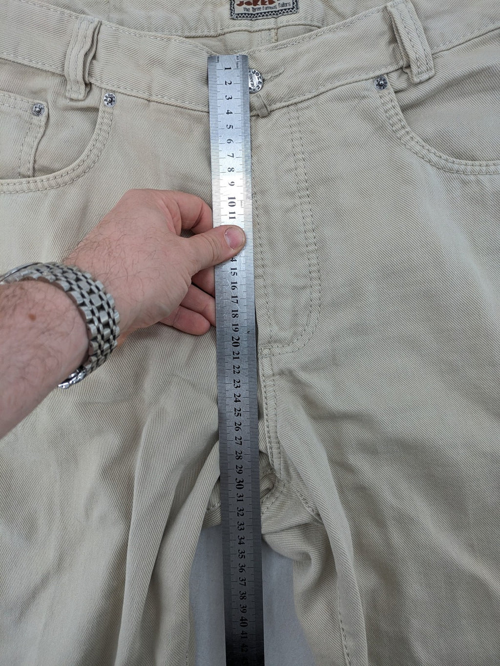 Joker beige straight jeans 5-pocket design with zipper and button closure.