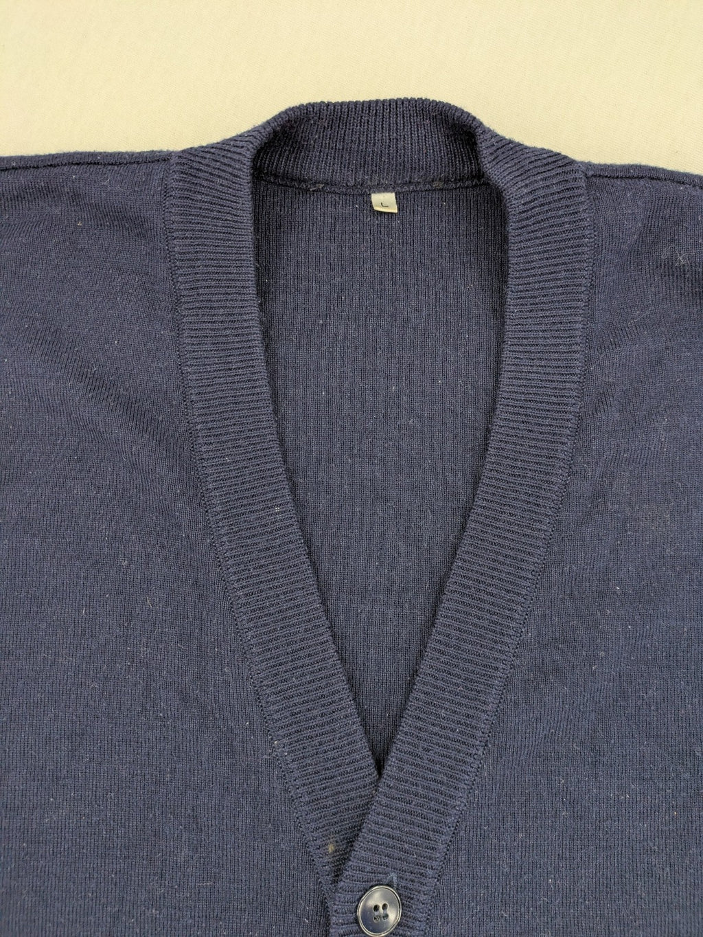 Schurwolle navy knit jumper classic V-neck with button placket, made from wool blend.
