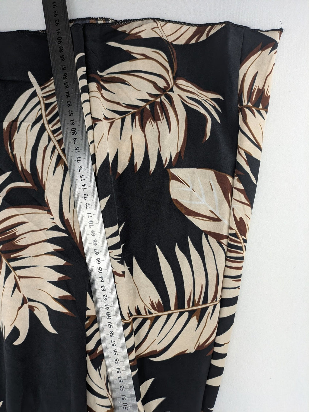 Kontrast summer dress beige tropical leaf print with black ribbed tank top and lace trim.
