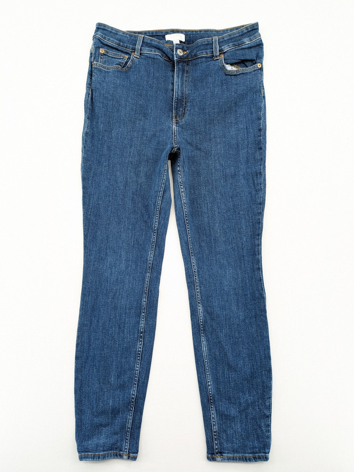 H&M blue skinny jeans with stretch denim and slim fit design.
