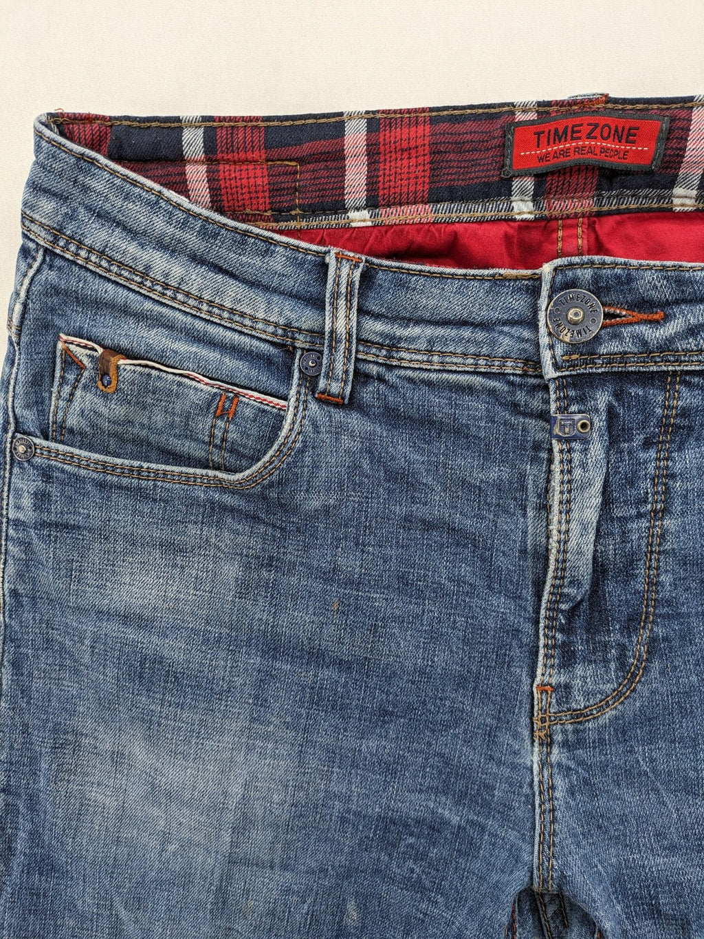 Timezone blue straight jeans slim fit with checkered pattern lining and button fly.