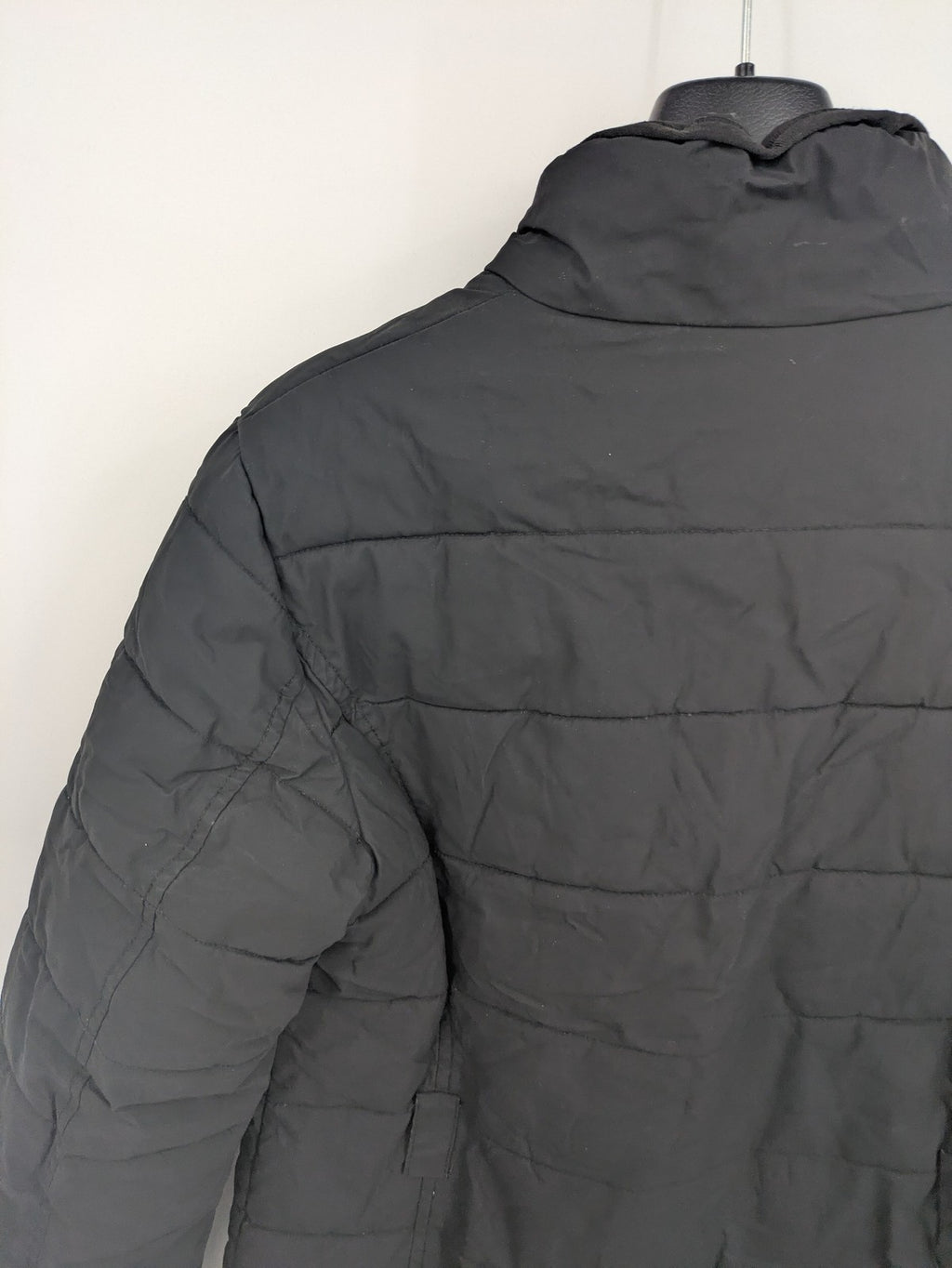 Mark Adam grey quilted jacket with high collar and buttoned flap pockets.