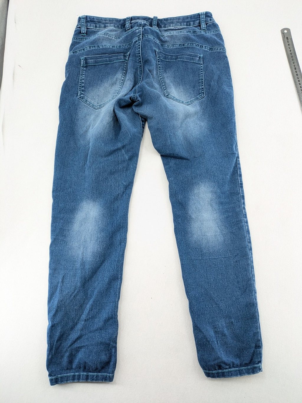 Rainbow blue straight jeans jogger style with button fly and contrasting turquoise stitching.