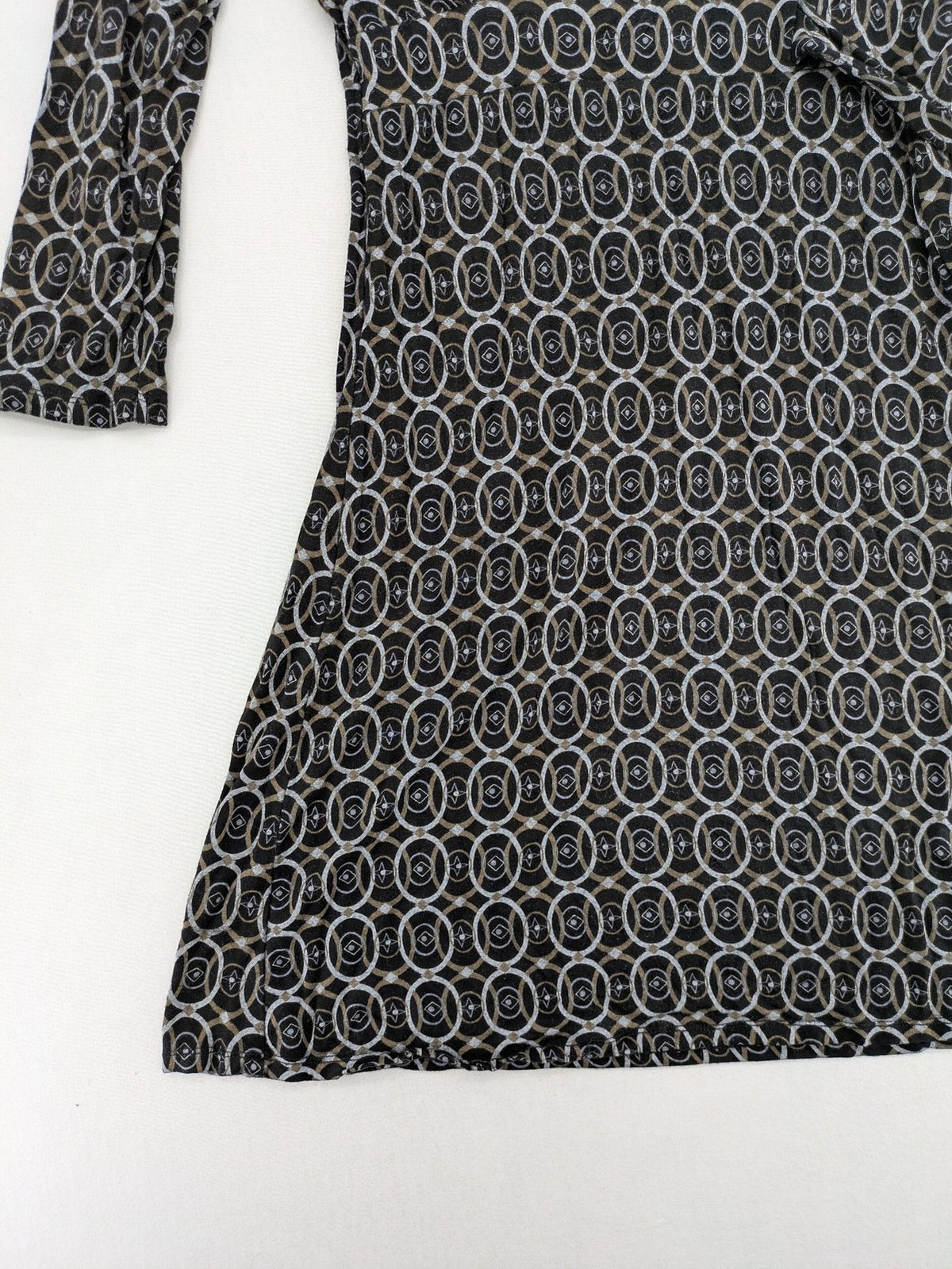 TCM pink wrap dress with V-neck, 3/4 sleeves, geometric black, white, and brown pattern.
