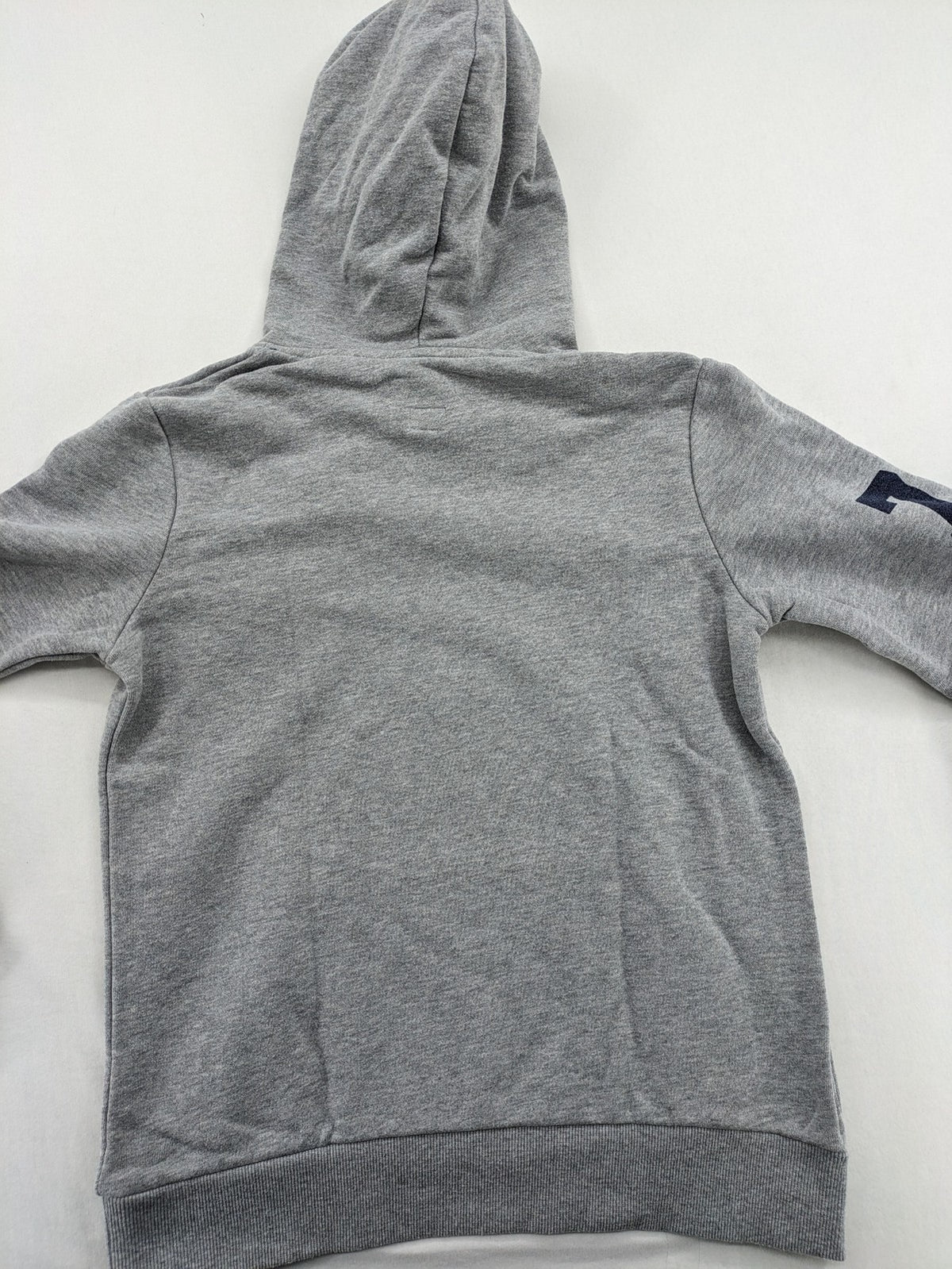 Superdry grey hoodie with Sonics logo, number 7 detail, kangaroo pocket, and drawstring hood.