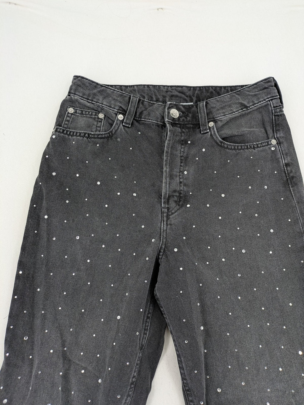 H&M Divided black straight jeans with allover rhinestone embellishments and classic five-pocket design.