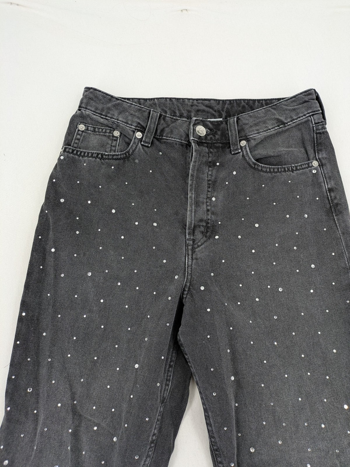 H&M Divided black straight jeans with allover rhinestone embellishments and classic five-pocket design.