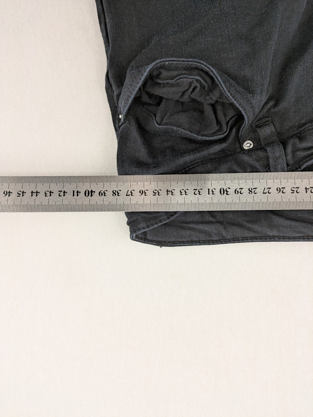 H&M grey skinny jeans with faded wash and soft stretch denim material.