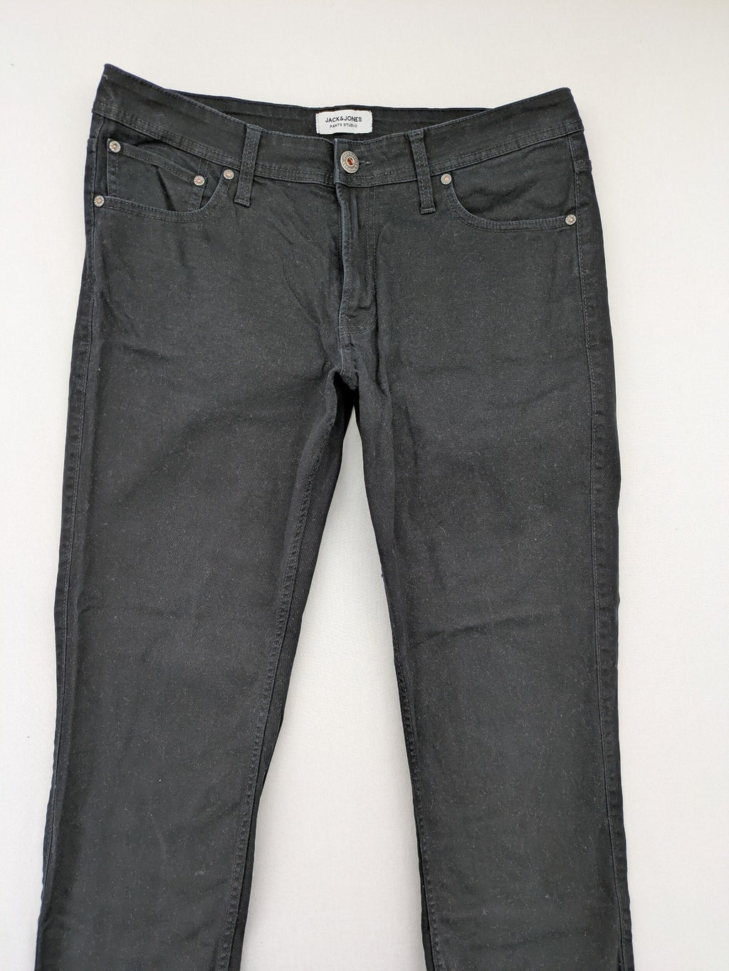 Jack & Jones black slim fit jeans with logo patch and cotton-stretch blend.