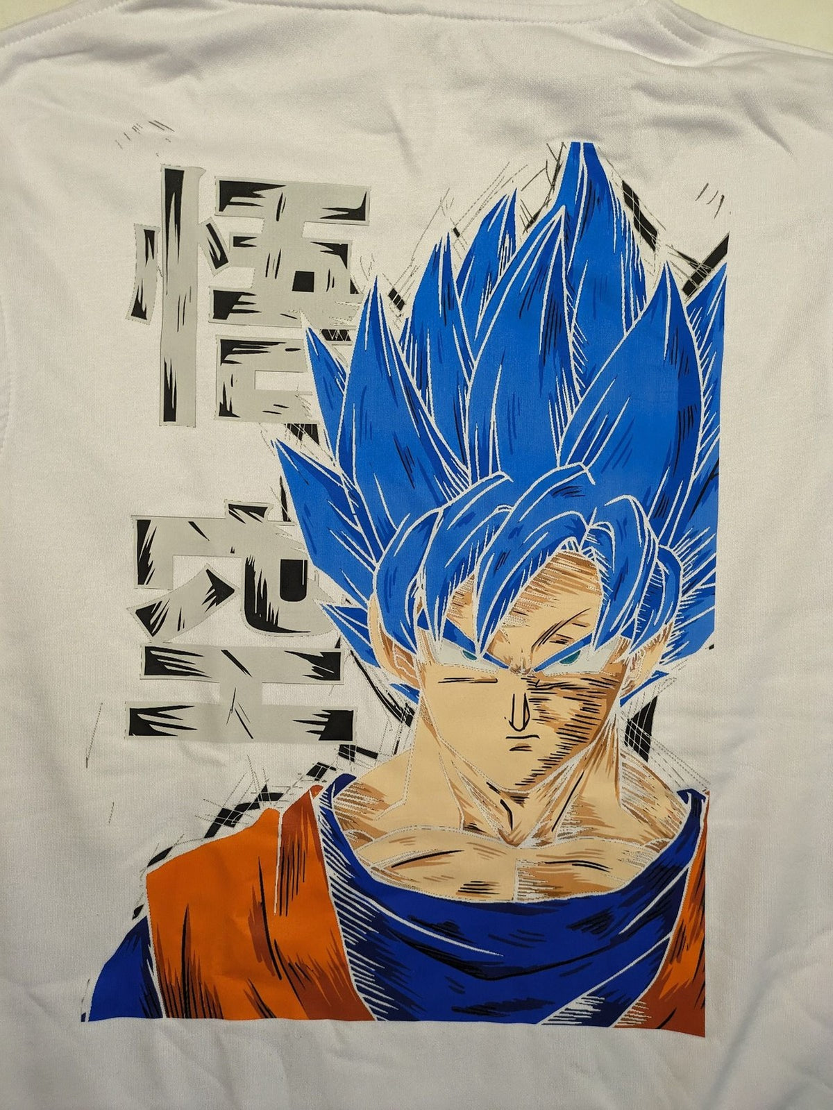 Dragon Ball Z blue hoodie with large Goku Super Saiyan Blue graphic print on back.