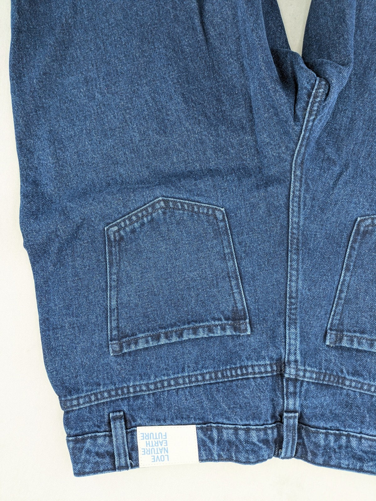 Tchibo blue straight jeans with five-pocket design and wide leg cut in durable cotton.