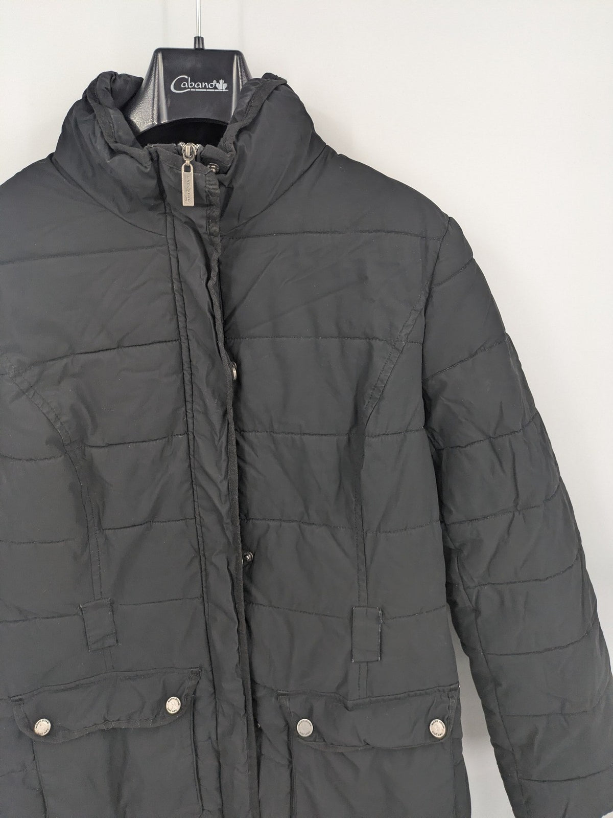 Mark Adam grey quilted jacket with high collar and buttoned flap pockets.