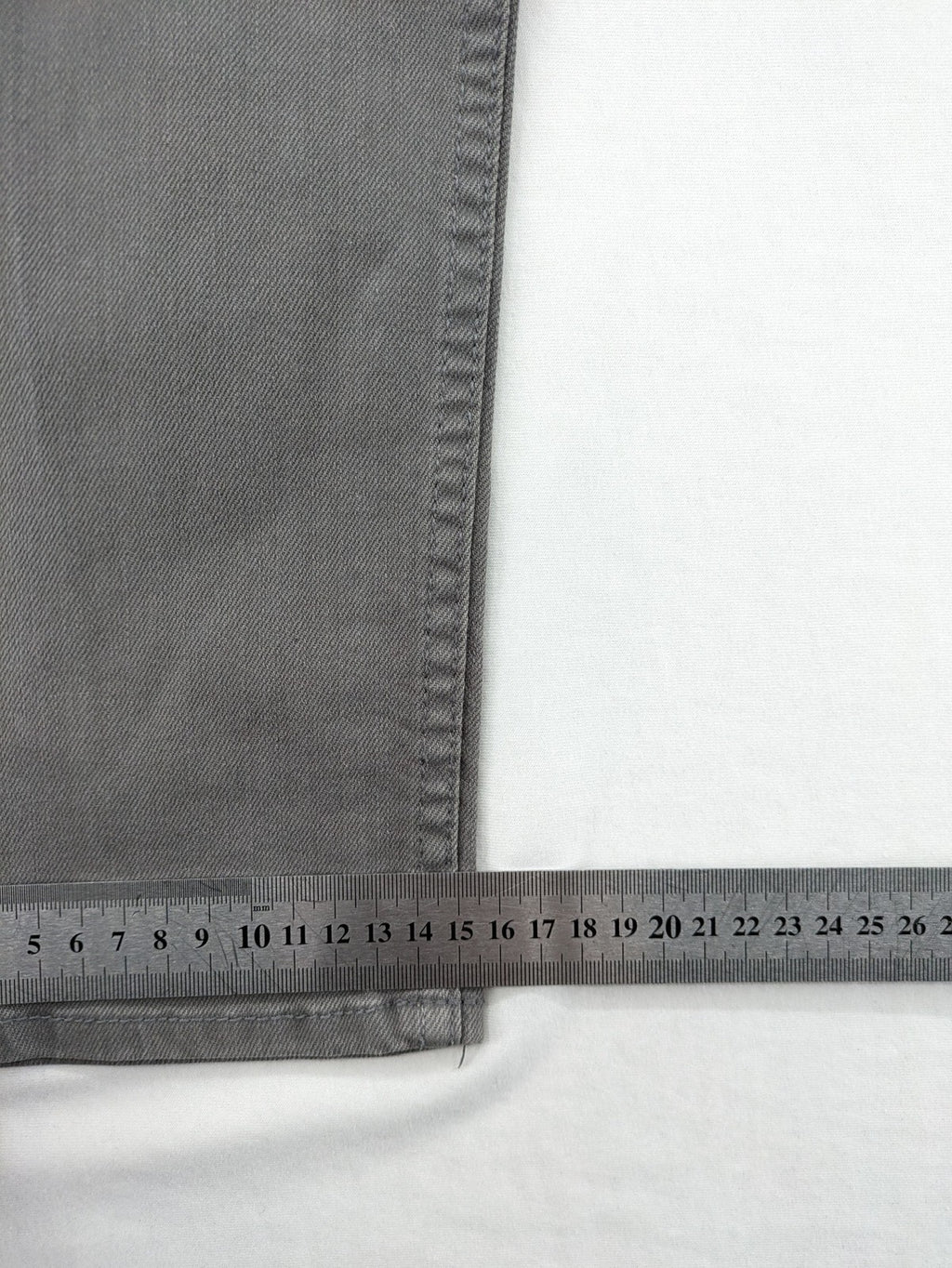 H&M grey skinny fit jeans with button closure and five-pocket design, cotton-elastane blend.