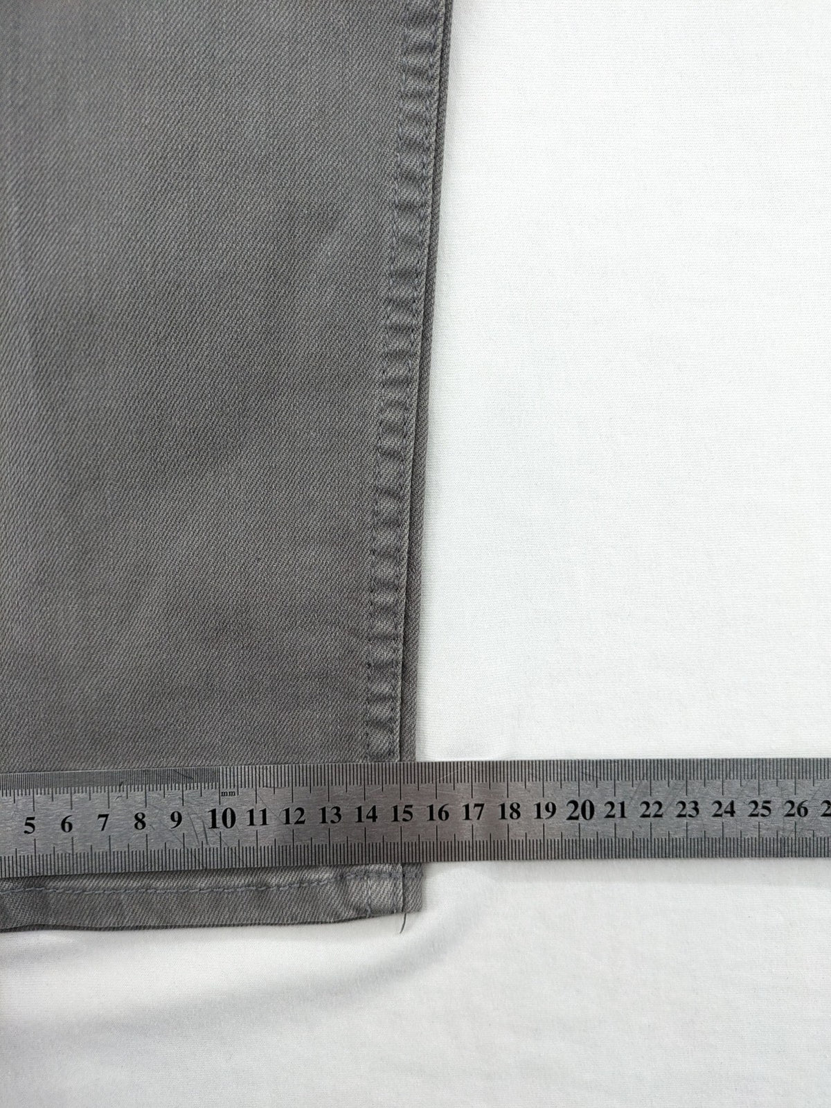 H&M grey skinny fit jeans with button closure and five-pocket design, cotton-elastane blend.