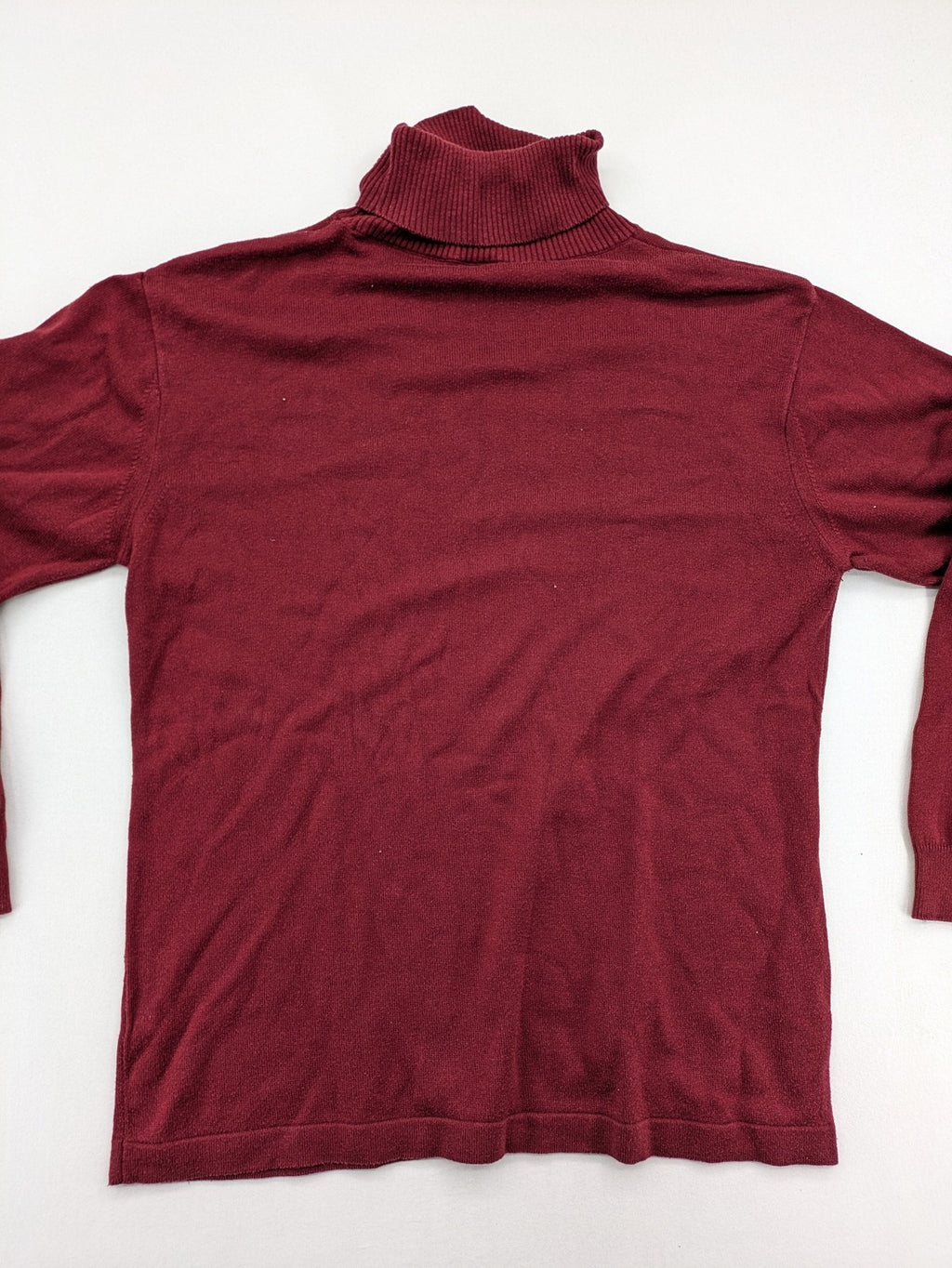 Les Corps burgundy turtle neck jumper with ribbed details and soft cotton blend material.