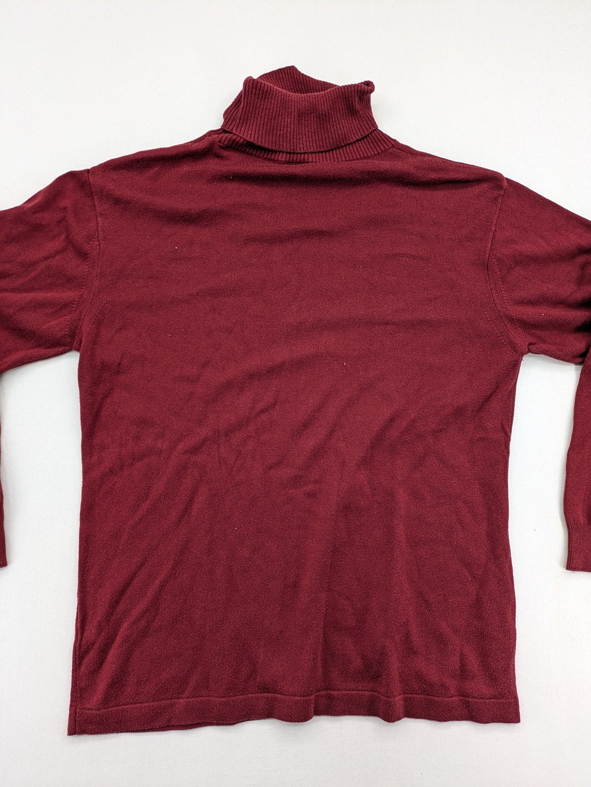 Les Corps burgundy turtle neck jumper with ribbed details and soft cotton blend material.