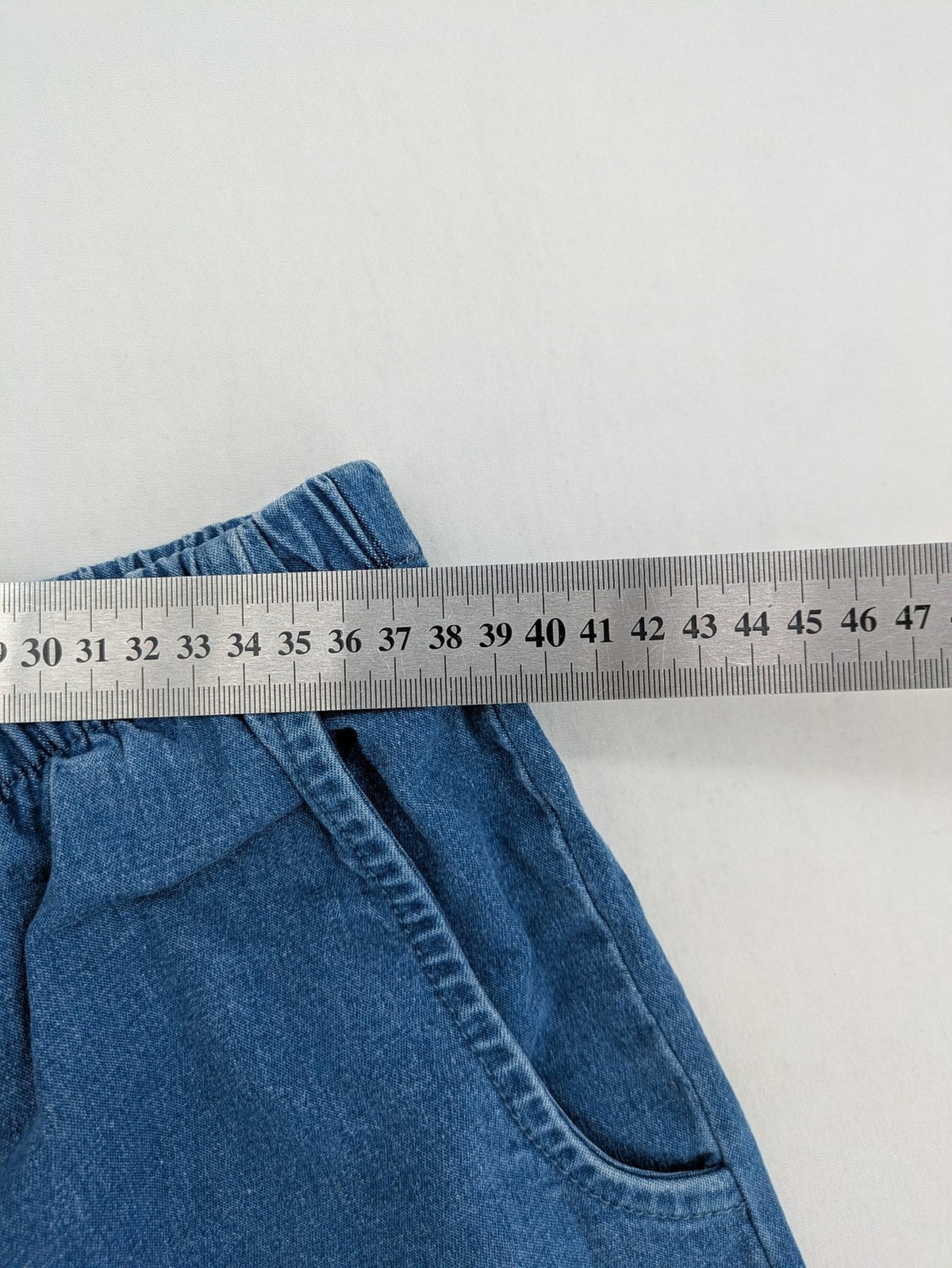 Denim & Co. blue capri pants with elastic waistband and side pockets, cotton blend.