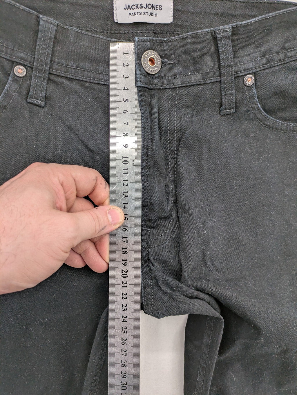 Jack & Jones black slim fit jeans with logo patch and cotton-stretch blend.