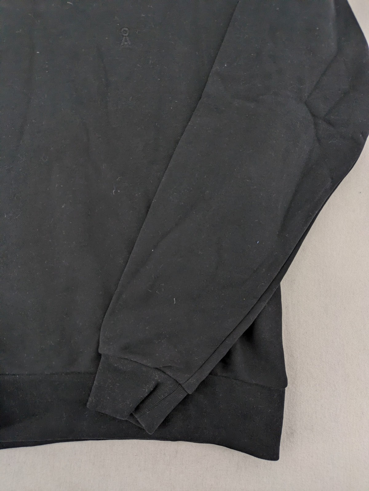Armedangels black turtle neck jumper with embroidered logo, made from 100% organic cotton.