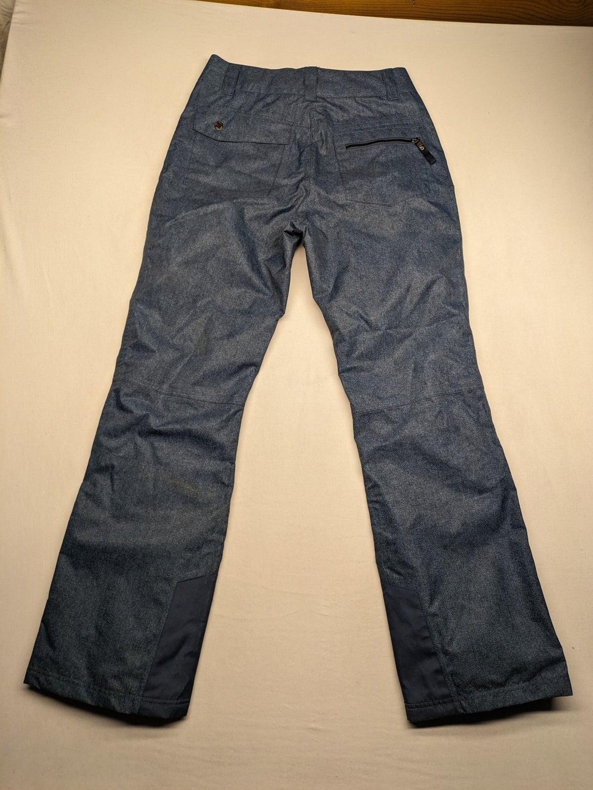 Snow Tech blue ski pants with modern denim look and durable polyester material.