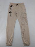 Naruto Shippuden beige joggers featuring Naruto Uzumaki graphic and logo print.