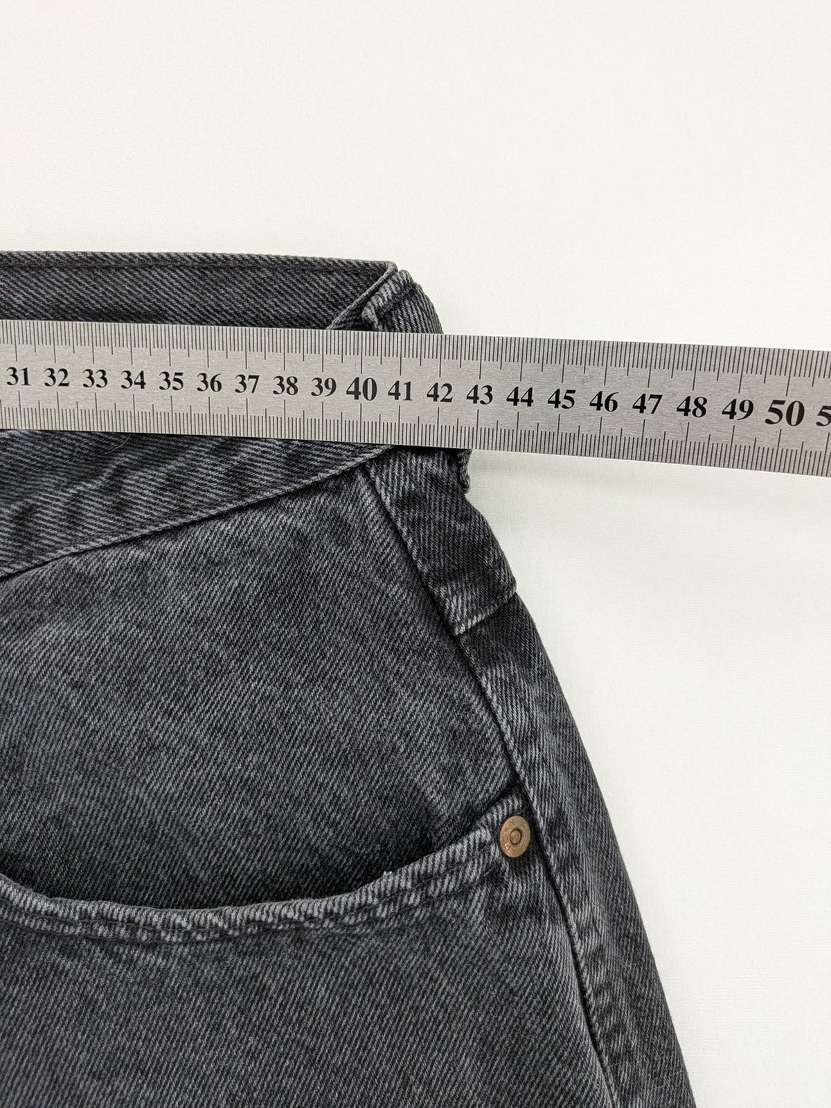Lucky Star grey tapered high waist jeans with faded wash and red logo details.