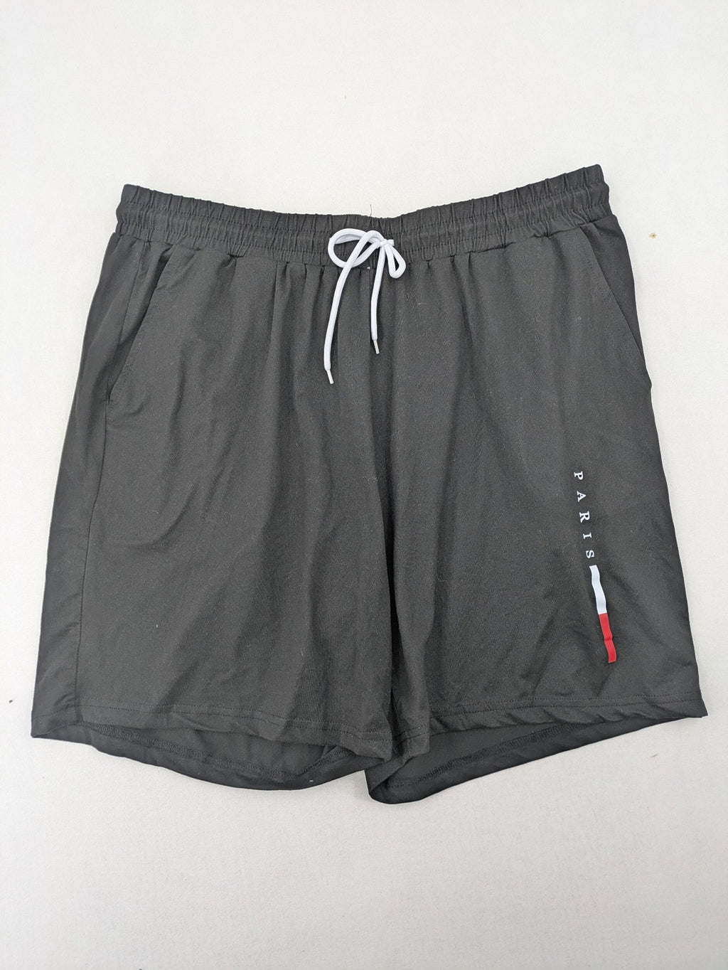 Manfinity loungewear set black T-shirt and shorts with Paris graphic print.