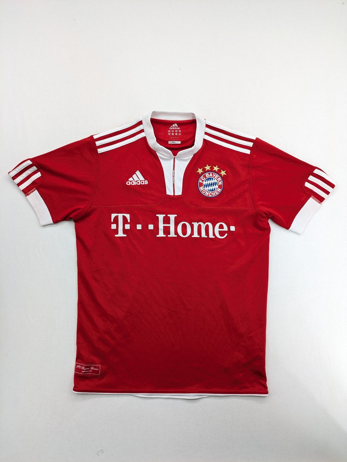 Adidas red soccer uniform with T-Home logo and embroidered FC Bayern München crest.
